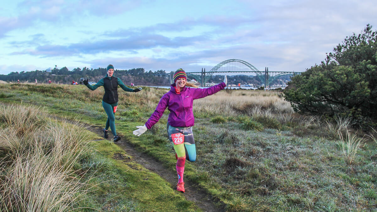 A couple celebrating at the finish line.